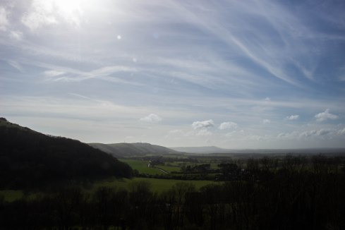 Dyke Hill, wooded on the left. Truleigh Hill with the radio masts on its summit and Chanctonbury Ring visible to its right